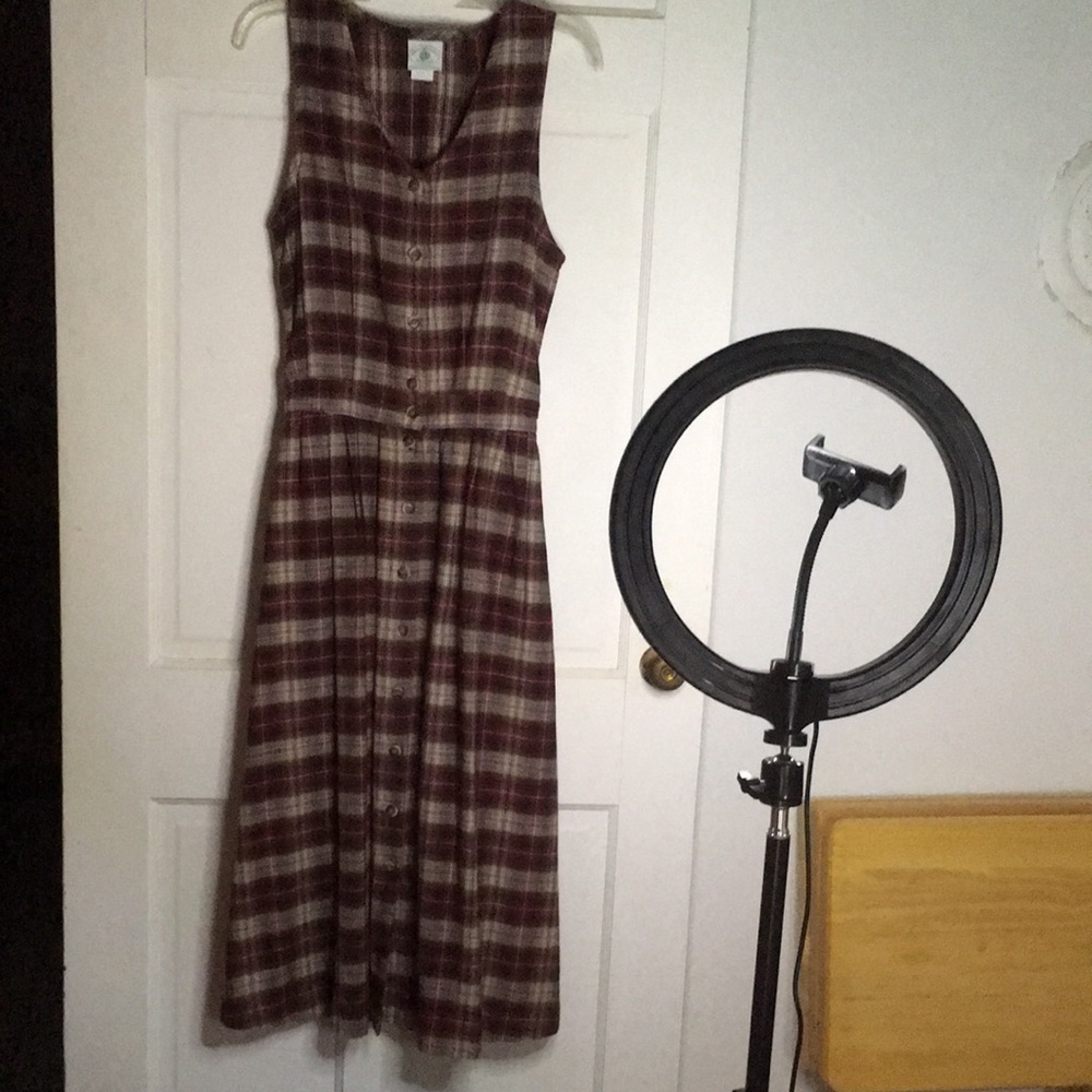 Dress: V-neck, button down sleeveless.